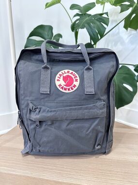 Fjallraven Kånken Backpack in Charcoal Gray with Red Logo